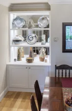 Alcove cupboards with mirror display shelves