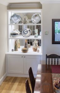 Alcove cupboards with mirror display shelves