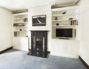 Ornate styled alcove Cupboards with traditional features