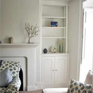 alcove unit with traditional styled framed cabinet fitted up to ceiling. Moulded doors with a simple panel bead, Painted in White eggshell