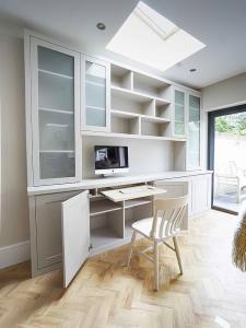 Built in Cabinets with glass doors and occassional home office pull out desk