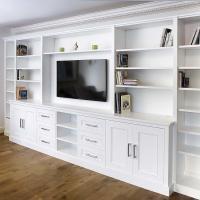 Built in cabinets around TV with shelving