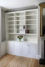 Built in cabinets with triple bookcases with open area fitted in to an alcove (Custom)