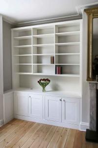 Built in cabinets with triple bookcases with open area fitted in to an alcove (Custom)