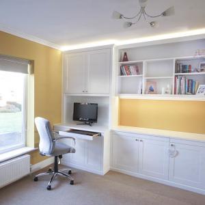 home office with built in cabinets