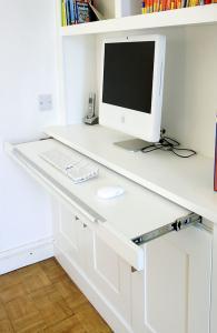 Home office workstation in an alcove cupboard