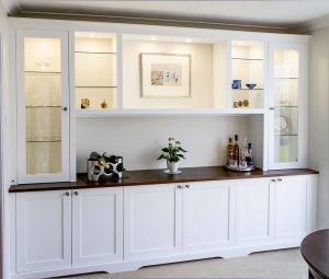 Large living room built in cupboards with glazed door display cabinets