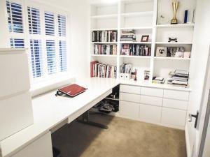 Modern home study with height raised desk