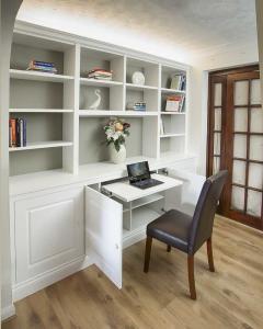 bespoke cabinets and bookcases with pull out desk home office