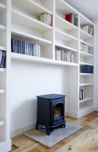 built in bookcases either side of fireplace