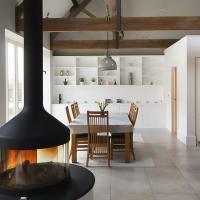 large fitted cabients and shelving in living room barn conversion