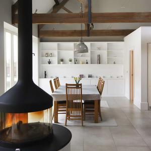 large fitted cabients and shelving in living room barn conversion