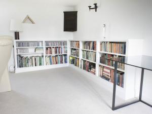 low level fitted bookcases in white