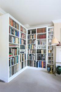 Bespoke Library shelving fitted in to a corner of a living room