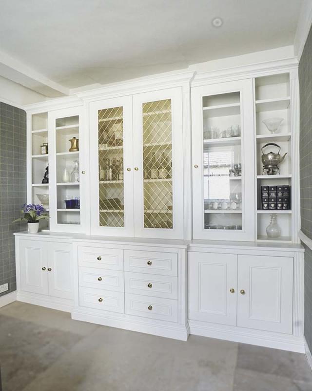 Built in Cupboards living room with glass doors Built in Solutions