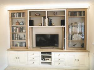 Built in TV unit in traditional design with glass doors