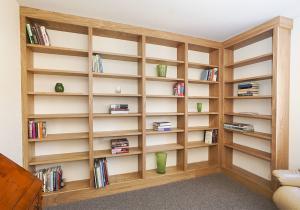 Fitted library in Oak along two walls in a spare room