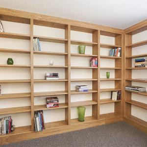 Fitted library in Oak along two walls in a spare room