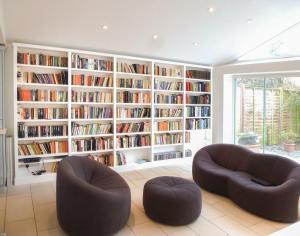 Home Library shelving along wall in bright room