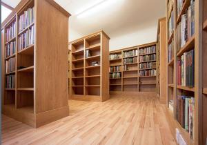 Home library shelving units in converted garage