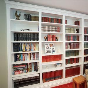 Home library with ornate cornice and fluting detail