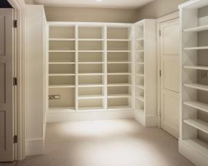 Large Home library room in white with lots of shelves