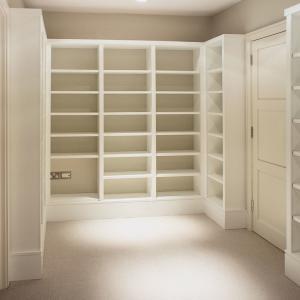 Large Home library room in white with lots of shelves