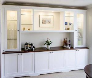 Large fitted dining room cupboards with glazed door display cabients