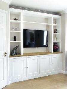Shaker built in cupboards with space for TV