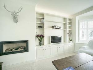 designer built in cupboards fitted into an alcove