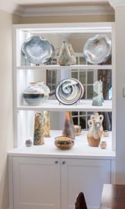 Glass Display cupboard in an alcove