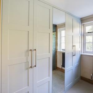 Modern fitted wardrobe with mirror door