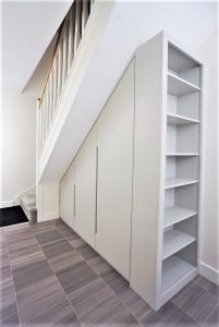 Modern built in wardrobe under stairs storage