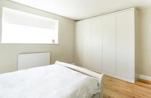 modern contemporary built in wardrobe fitted to bedroom