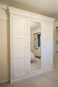 traditionally made Victorian wardrobes with bevelled mirror