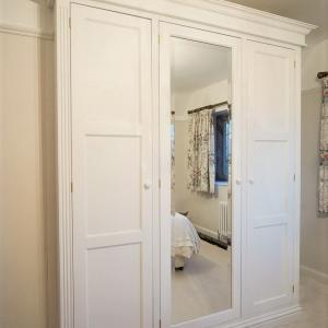 traditionally made Victorian wardrobes with bevelled mirror