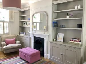 Grey painted alcove cupboards in Oxford period home