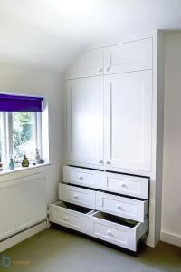 Built in shaker wardrobe with drawers in an alcove