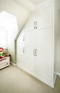 Built in wardrobes in loft in shaker style