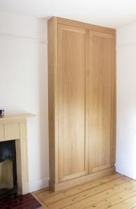 Buitl in alcove wardrobe in Oak