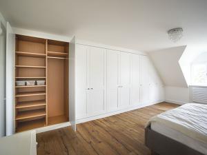 wall to wall white shaker built in wardrobe