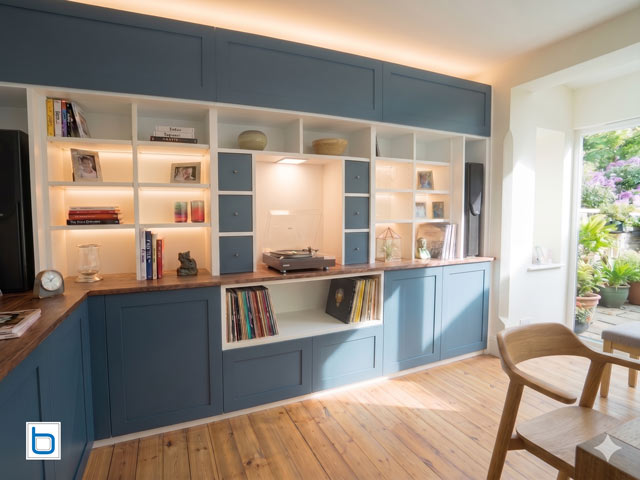 Fitted dining room furniture in kitchen — blue shaker cabinets with solid oak worktop and LED uplighting - F&B Stiffkey Blue