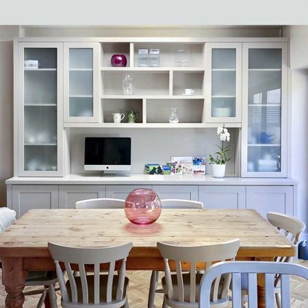 Fitted dining room display and storage cupboards with glazed upper sections and closed base storage