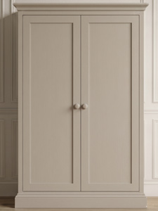 A face-on sample photo showcasing a traditional two-door Shaker wardrobe style with inset panels, round knobs, a decorative crown cornice, and a moulded plinth base.