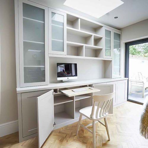 Built in Cabinets with glass doors and occassional home office pull out desk