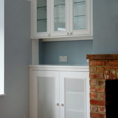 Built in alcove unit with glass doors