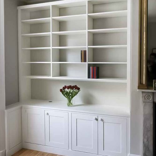 Built in cabinets with triple bookcases with open area fitted in to an alcove (Custom)