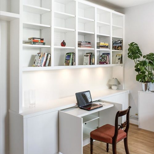 Contemporary modern fitted shelving with occasional pull out desk home office