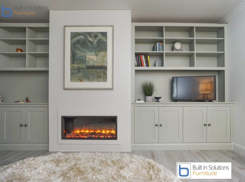 False chimney breast wall unit with electric fire and built in Alcove cupboards