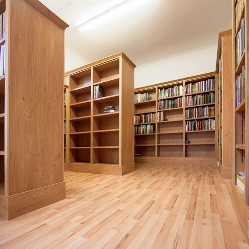Home library shelving units in converted garage